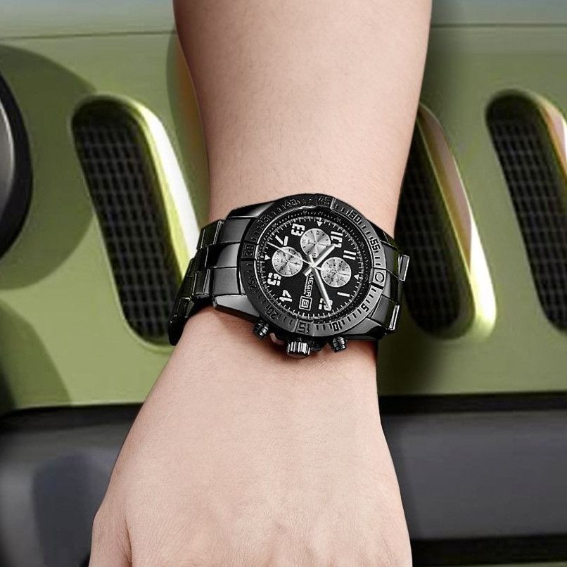 MEGIR 2030 men's chronograph watch on the wrist, all-black case with black dial and stainless steel bracelet