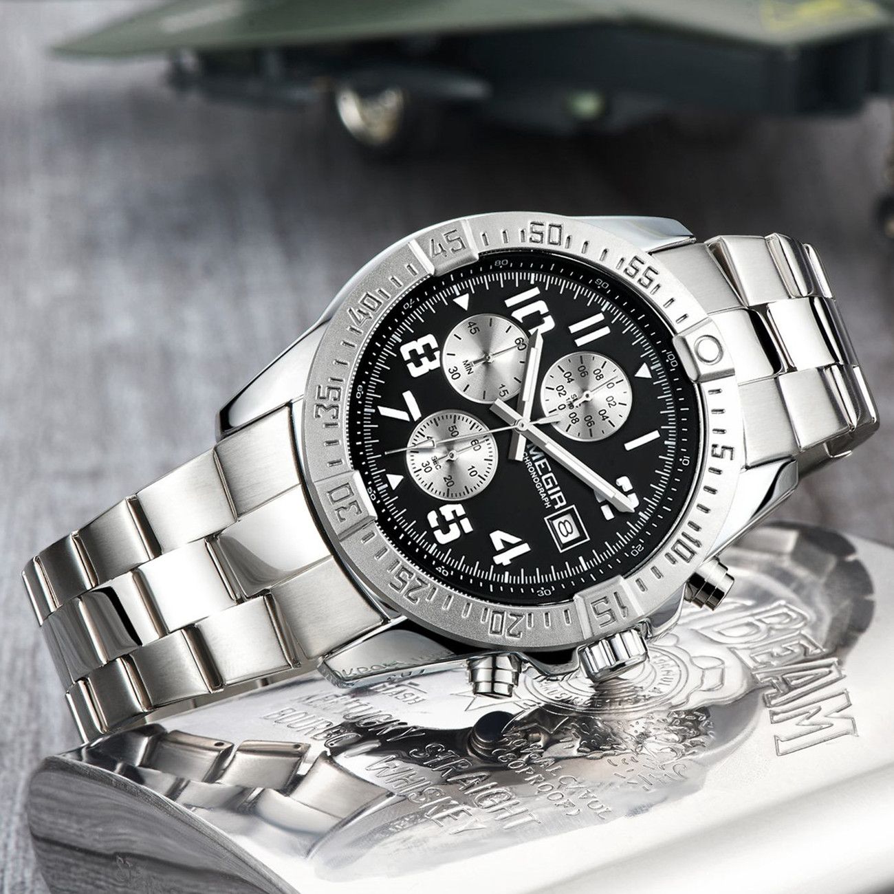 MEGIR 2030 men's chronograph watch, silver case with black dial and stainless steel bracelet, angled view