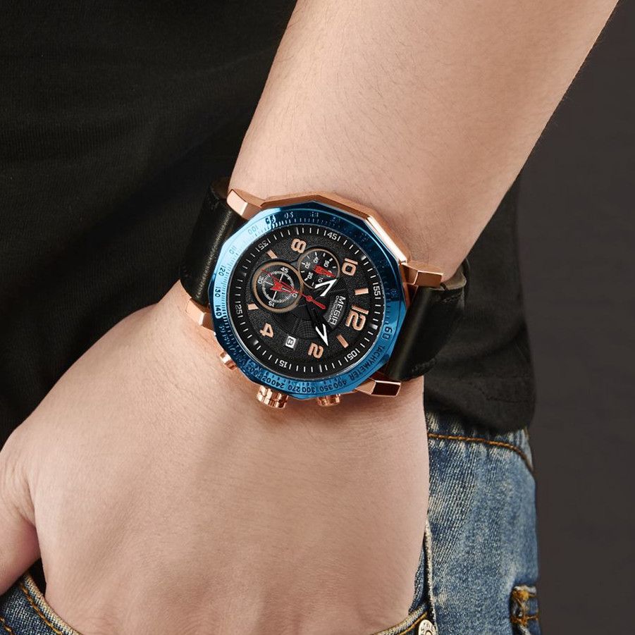 MEGIR 2048 men's chronograph watch on the wrist, rose-gold case with blue bezel, black dial and black leather strap