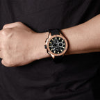 MEGIR 2053 men's chronograph watch on the wrist, rose-gold case with black dial and black silicone strap