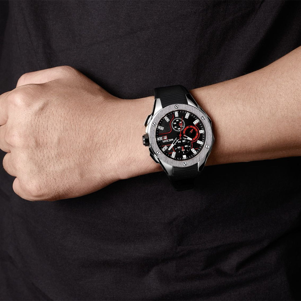 MEGIR 2053 men's chronograph watch on the wrist, silver case with black dial, red accents and black silicone strap
