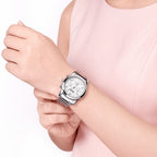 MEGIR 2057 women's chronograph watch on the wrist, silver case with white dial and stainless steel bracelet