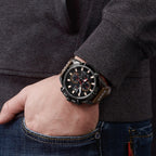MEGIR 2062 men's chronograph watch on the wrist, gunmetal case with black dial and brown leather strap