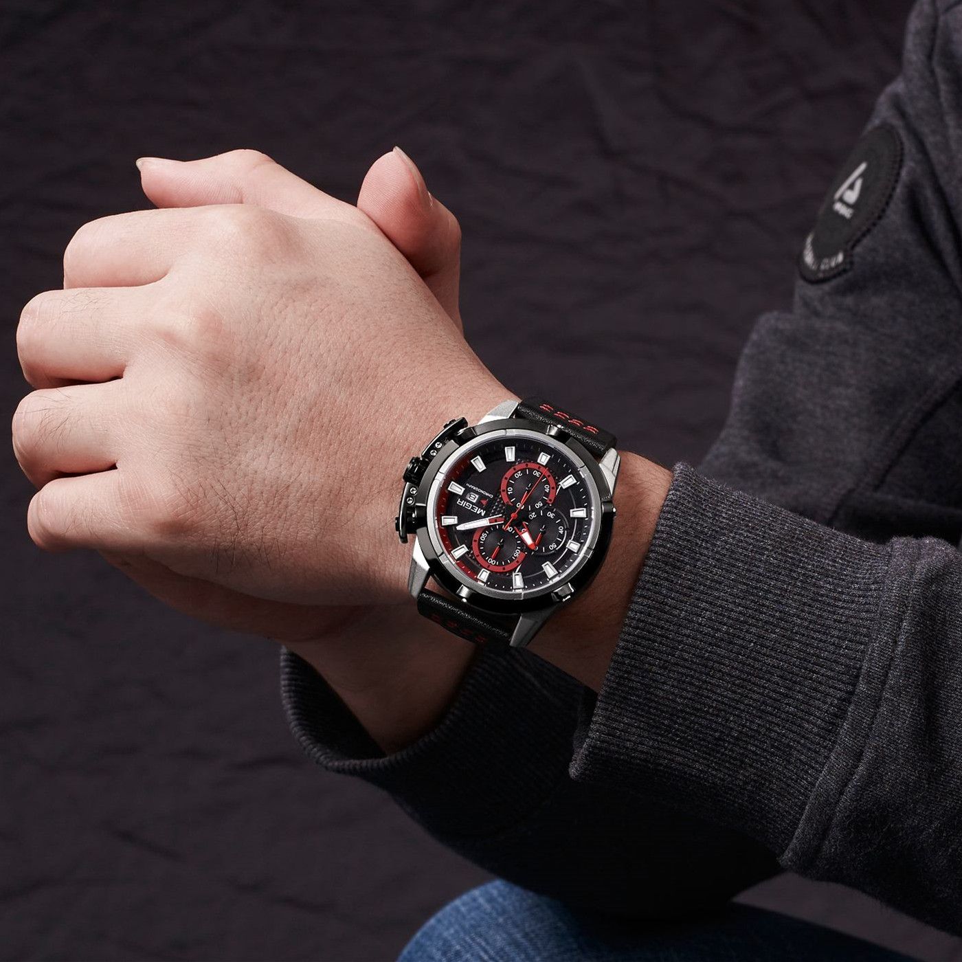 MEGIR 2062 men's chronograph watch on the wrist, silver case with black dial, red accents and black leather strap