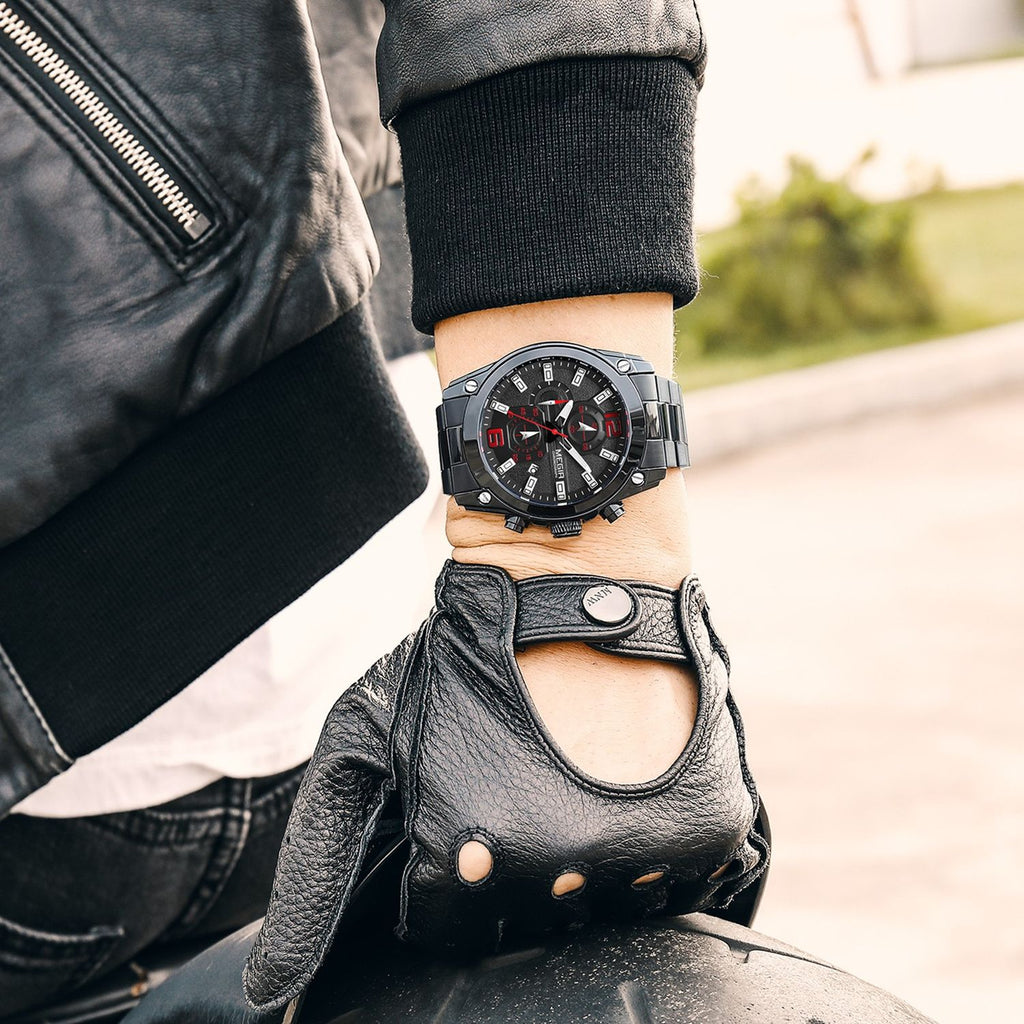 MEGIR 2063 men's chronograph watch on the wrist, all-black case with black dial and black stainless steel bracelet