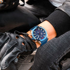 MEGIR 2063 men's chronograph watch on the wrist, rose-gold case with blue dial and blue steel bracelet
