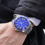MEGIR 2064AG men's dive watch on the wrist, silver case with blue dial and stainless steel bracelet