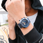 MEGIR 2065 men's chronograph watch on the wrist, rose-gold and blue case with blue dial and blue steel bracelet