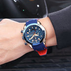 MEGIR 2065 men's chronograph watch on the wrist, rose-gold and blue case with blue dial and blue silicone strap