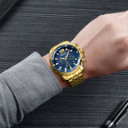 MEGIR 2068 men's chronograph watch on the wrist, gold-tone case with blue dial and gold stainless steel bracelet, close-up