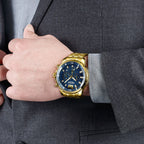 MEGIR 2068 men's chronograph watch on the wrist, gold-tone case with blue dial and gold stainless steel bracelet