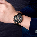 MEGIR 2070 men's chronograph watch on the wrist, rose-gold case with black dial and black leather strap
