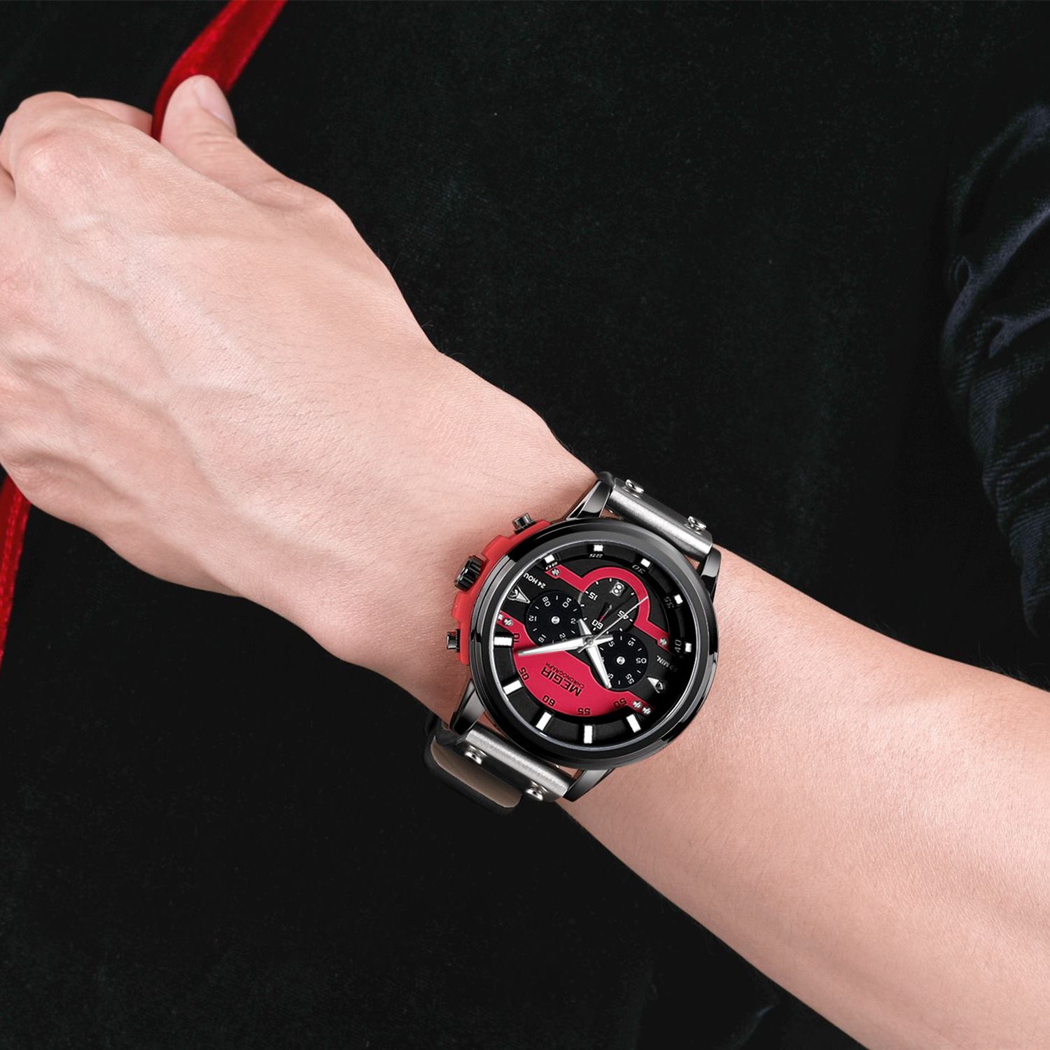 MEGIR 2080 men's chronograph watch on the wrist, black case with red and black dial and black leather strap