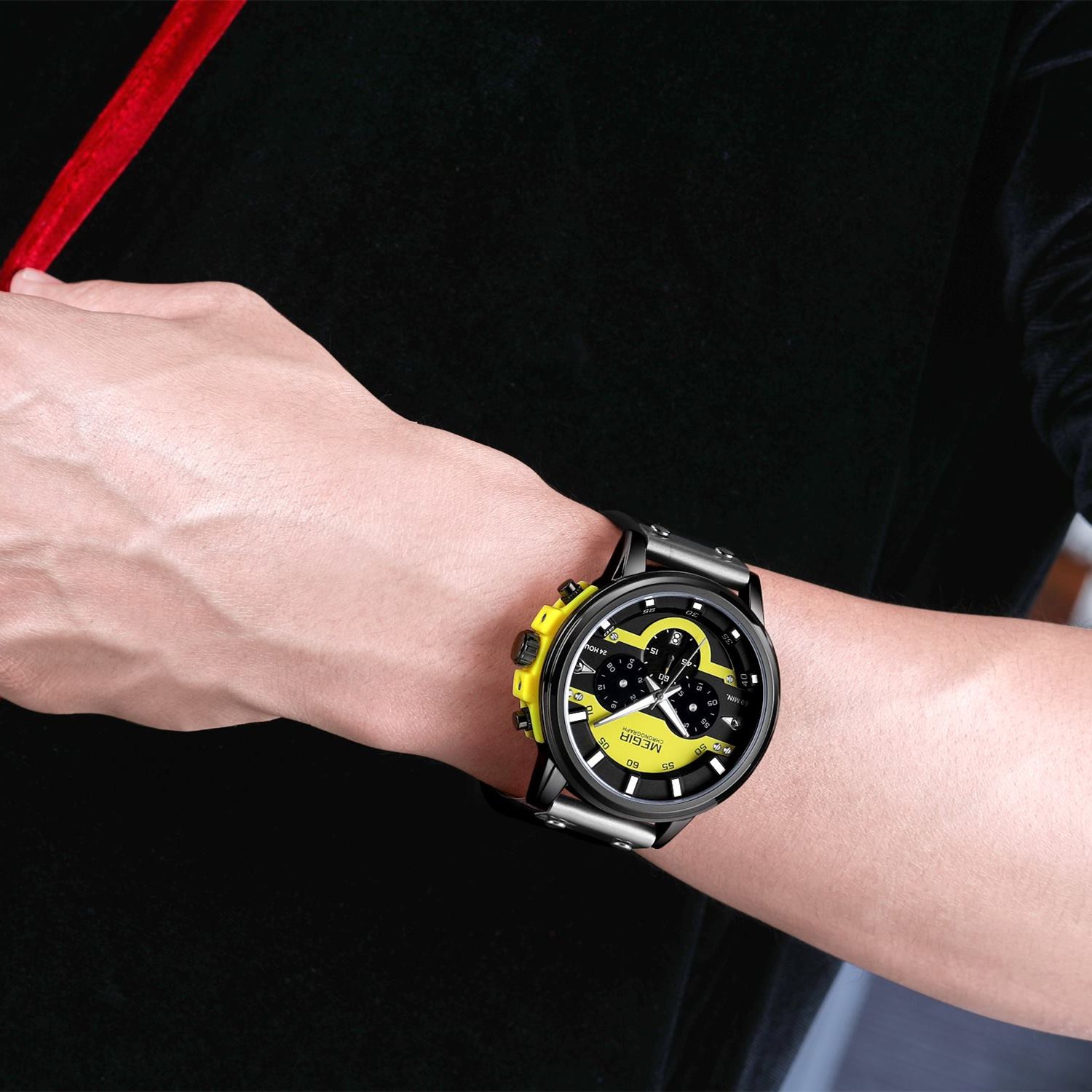 MEGIR 2080 men's chronograph watch on the wrist, black case with yellow and black dial and black leather strap
