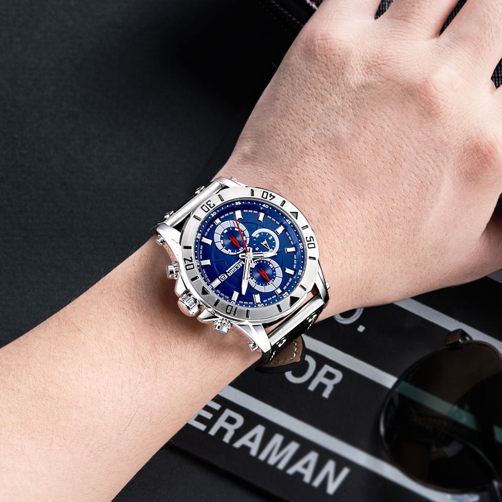 MEGIR 2081 men's chronograph watch on the wrist, silver case with blue dial and black leather strap