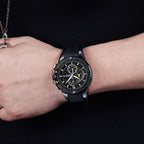 MEGIR 2095 men's chronograph watch on the wrist, black case with black dial, yellow accents and black silicone strap
