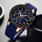 MEGIR 2095 men's chronograph watch, rose-gold case with blue dial, yellow accents and blue silicone strap, angled view