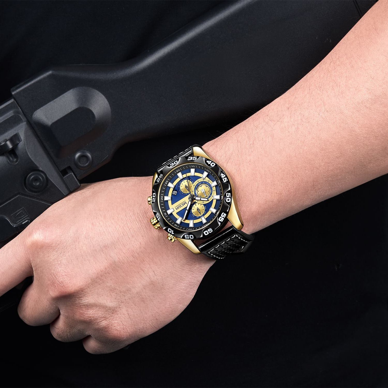 MEGIR 2096 men's chronograph watch on the wrist, gold-tone accents with blue and gold dial and black leather strap