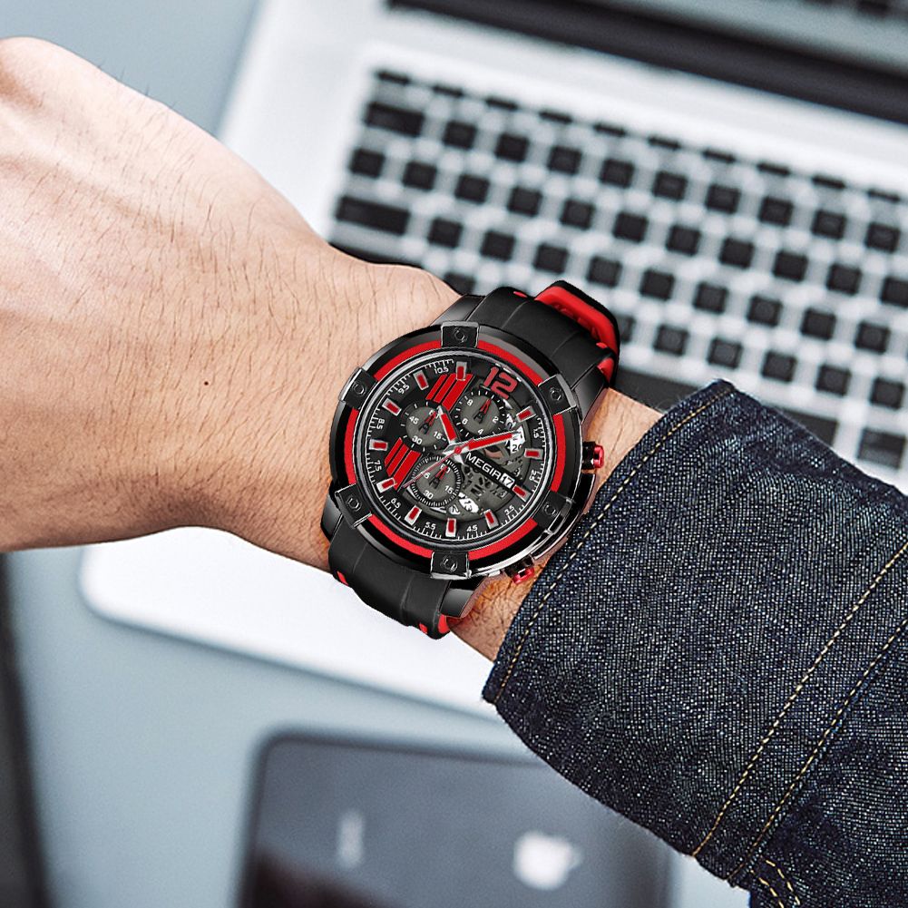 MEGIR 2097 men's chronograph watch on the wrist, black case with black dial, red accents and black silicone strap