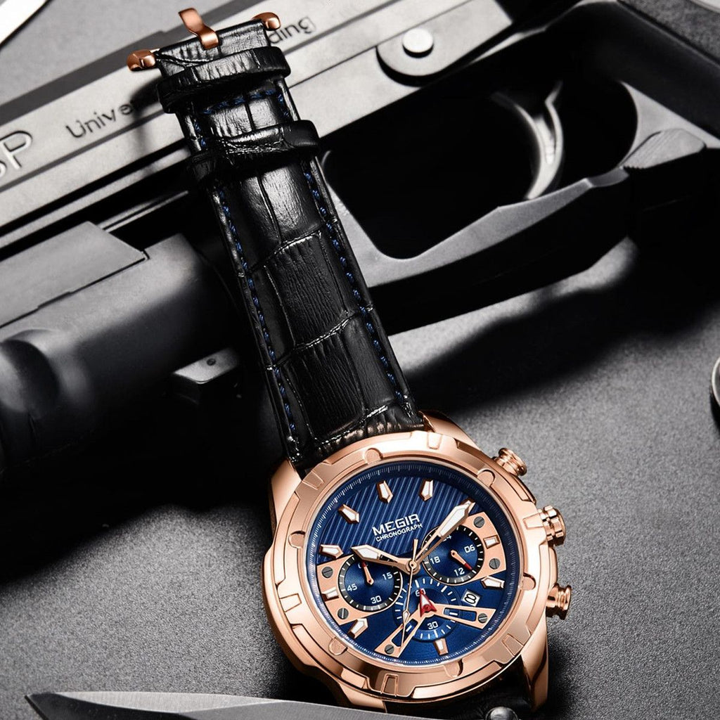 MEGIR 2102 men's chronograph watch, rose-gold case with blue dial and black leather strap, shown on a tactical prop
