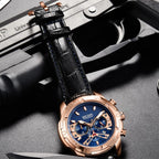 MEGIR 2102 men's chronograph watch, rose-gold case with blue dial and black leather strap, shown on a tactical prop