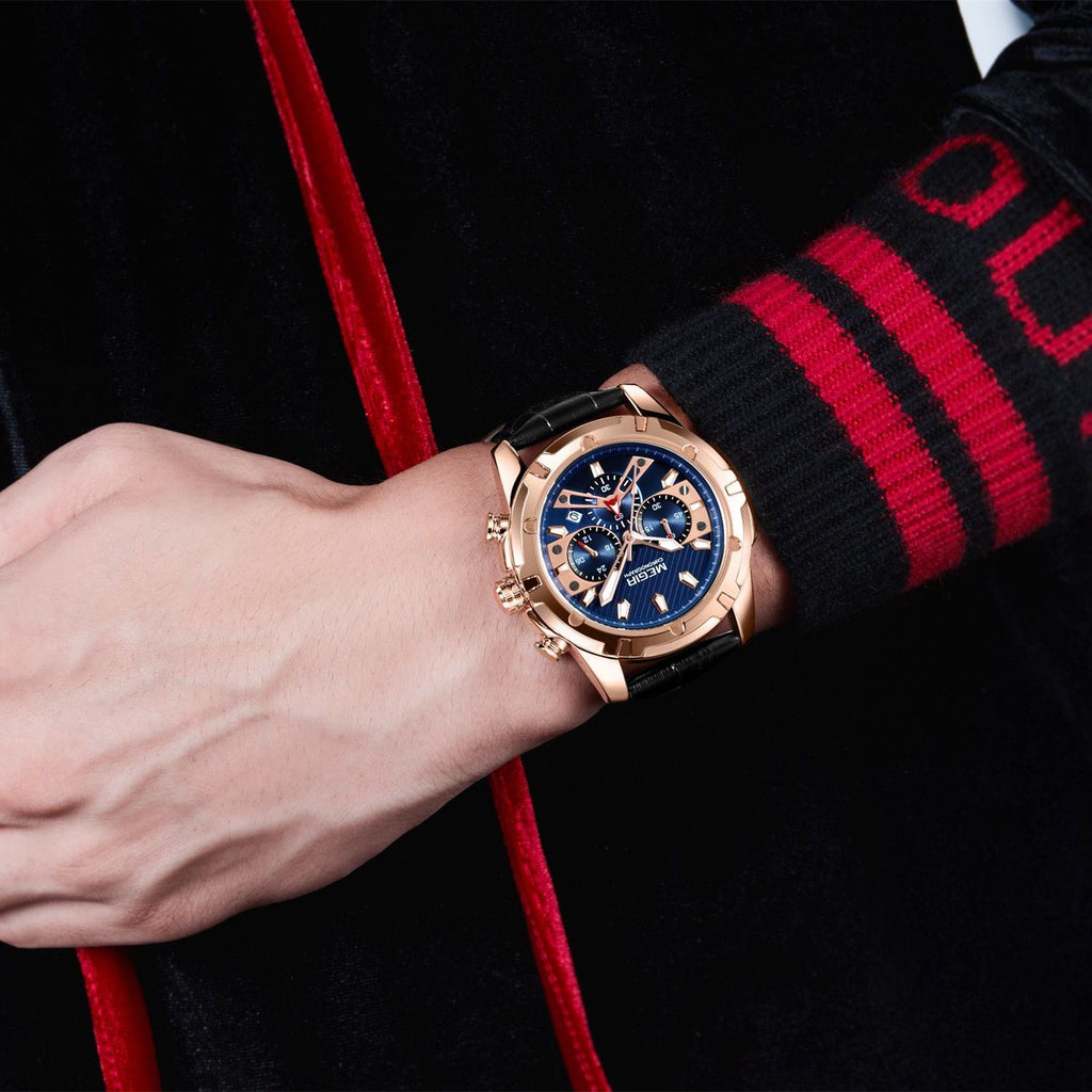 MEGIR 2102 men's chronograph watch on the wrist, rose-gold case with blue dial and black leather strap