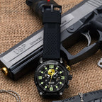 MEGIR 2116 men's chronograph watch, black case with black dial and black silicone strap, shown on a tactical prop
