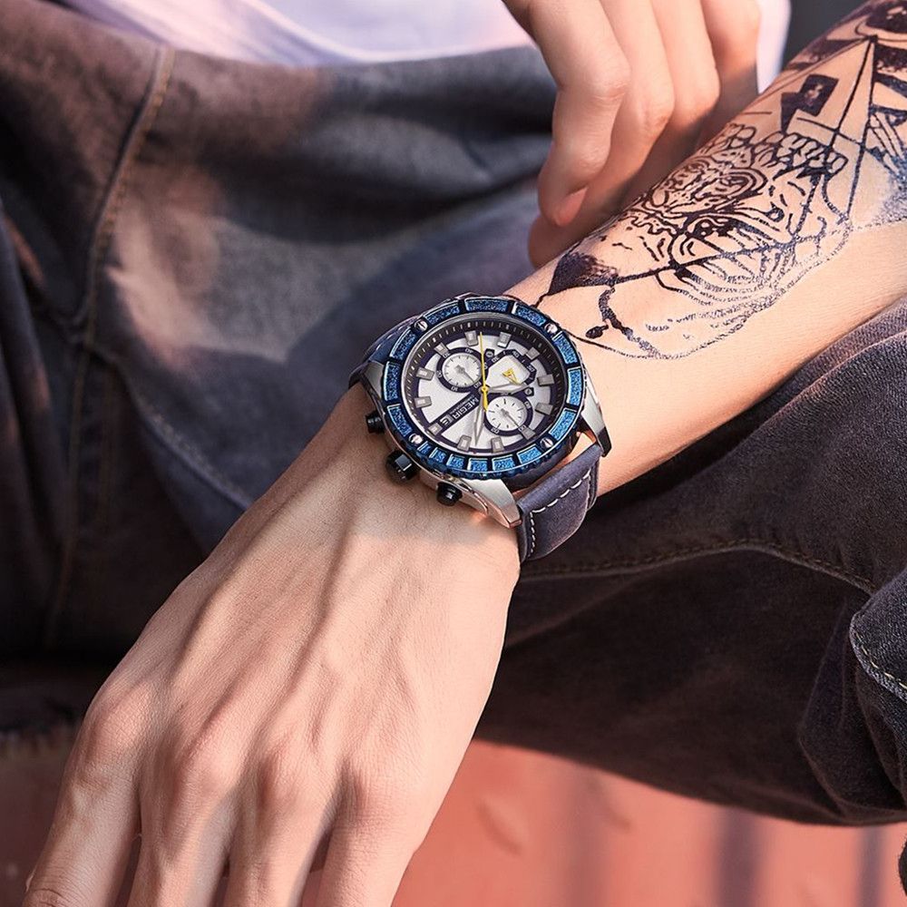 MEGIR 2119 men's chronograph watch on the wrist, silver case with blue bezel, white dial and blue leather strap