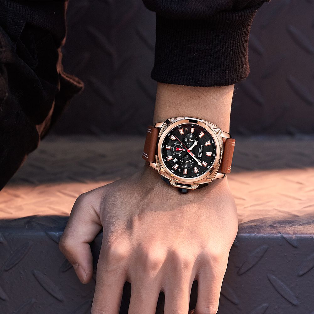 MEGIR 2128 men's chronograph watch on the wrist, rose-gold case with black dial and brown leather strap