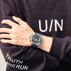 MEGIR 2128 men's chronograph watch on the wrist, silver case with black dial and black leather strap
