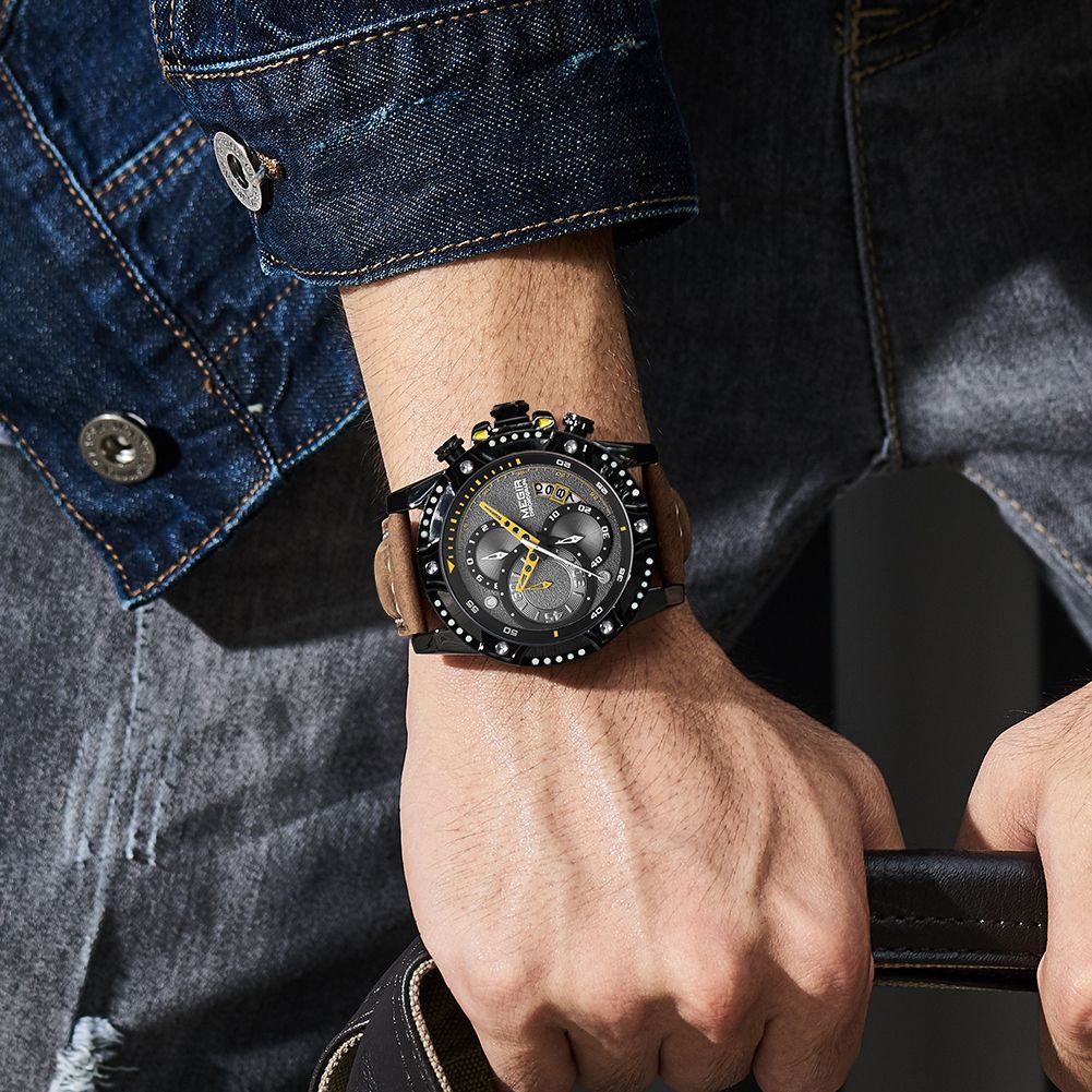 MEGIR 2130 men's chronograph watch on the wrist, black case with black dial and brown leather strap, close-up