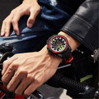 MEGIR 2133 men's chronograph watch on the wrist, black case with red bezel, black dial and black-and-red silicone strap