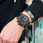 MEGIR 2134 men's chronograph watch on the wrist, black case with black dial and black steel bracelet