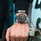 MEGIR 2134 men's chronograph watch on the wrist, silver case with black dial and stainless steel bracelet