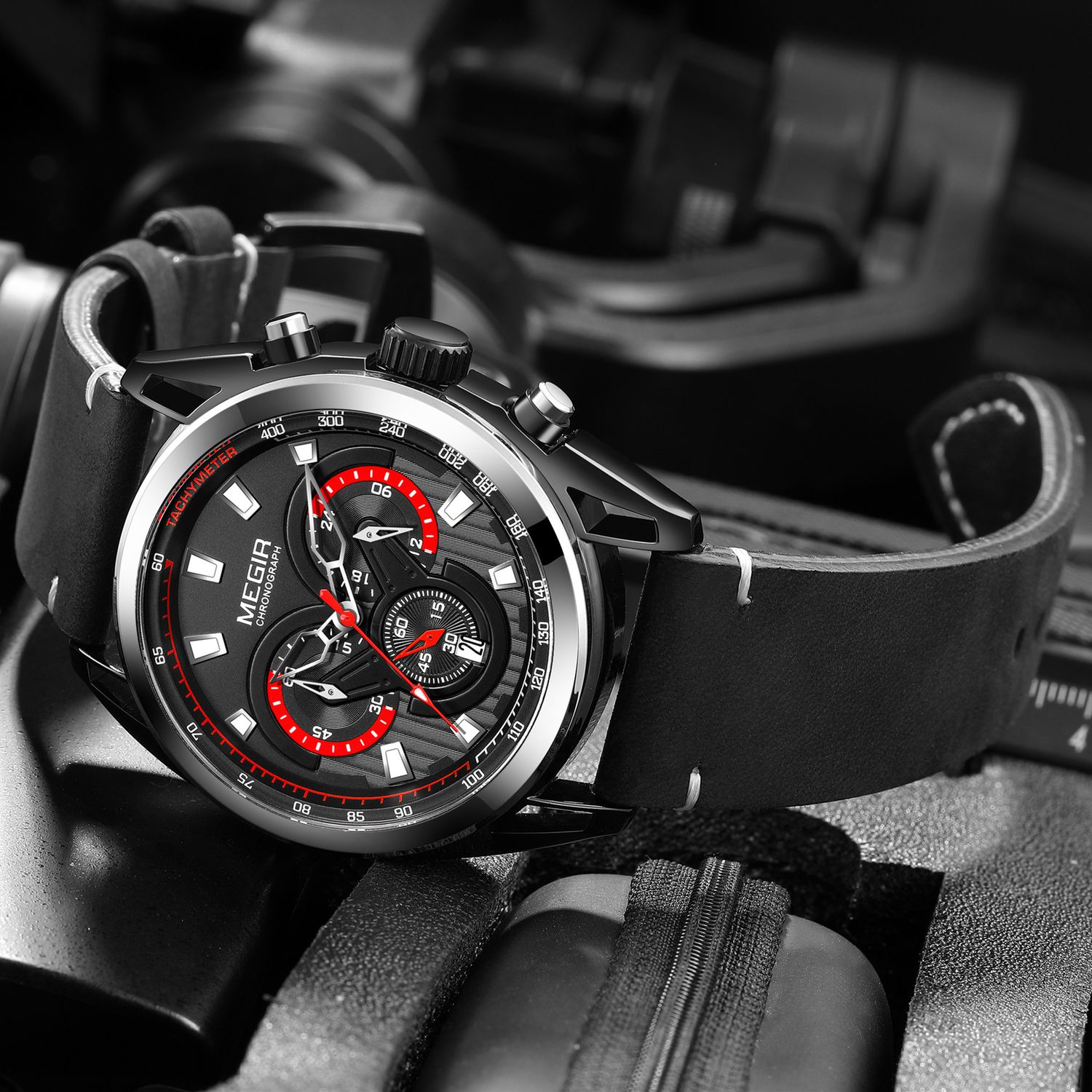 MEGIR 2135 men's chronograph watch, black case with black dial and black leather strap, angled view