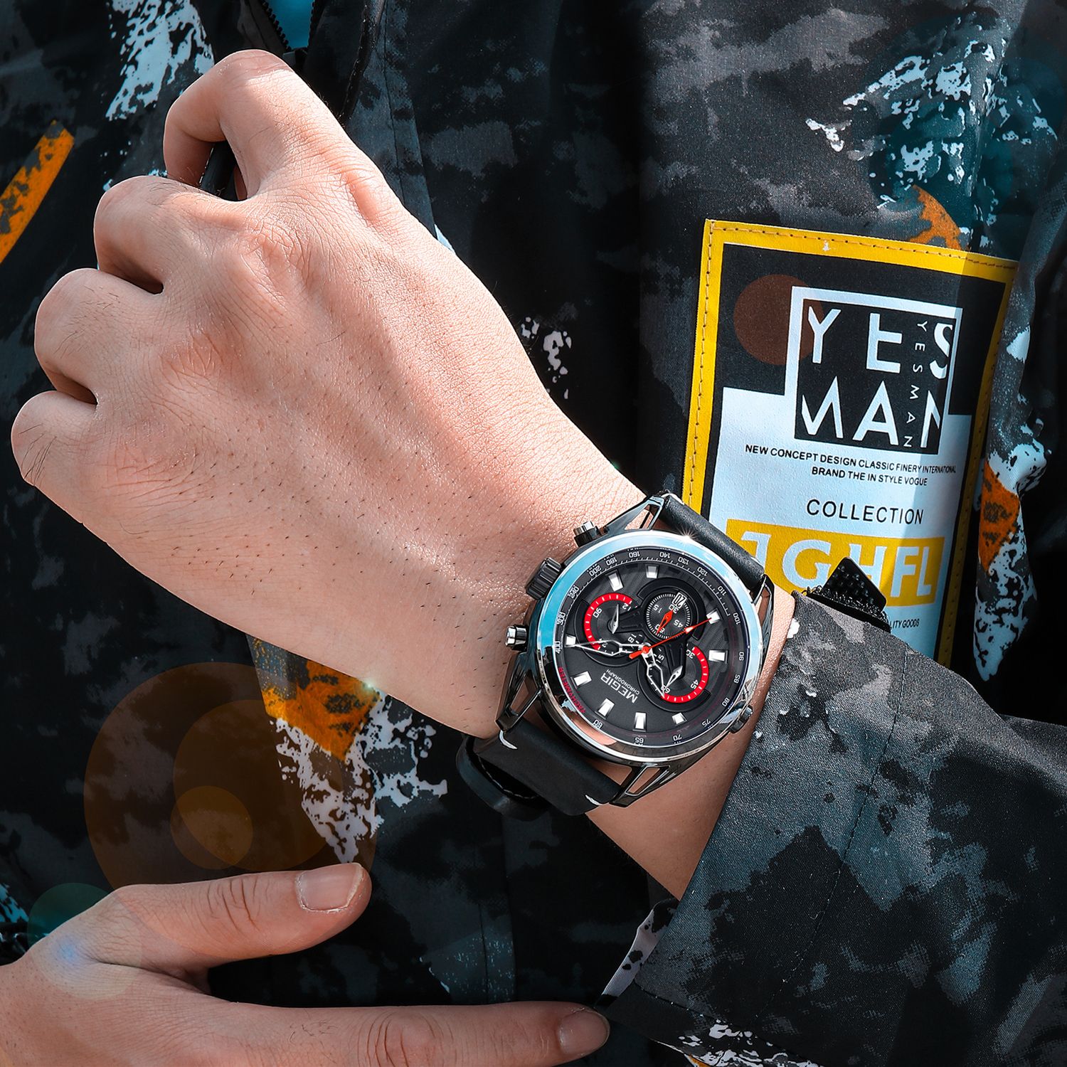 MEGIR 2135 men's chronograph watch on the wrist, black case with black dial and black leather strap