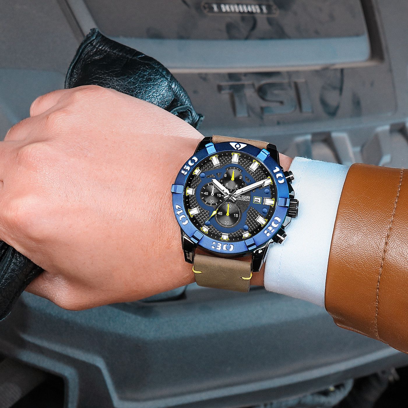 MEGIR 2136 men's chronograph watch on the wrist, blue bezel with black dial and brown leather strap