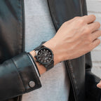 MEGIR 2150 men's chronograph watch on the wrist, black case with black dial and black steel bracelet