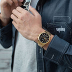 MEGIR 2150 men's chronograph watch on the wrist, gold case with black dial and gold bracelet