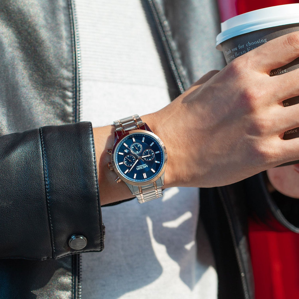MEGIR 2150 men's chronograph watch on the wrist, rose-gold and silver case with blue dial and two-tone steel bracelet