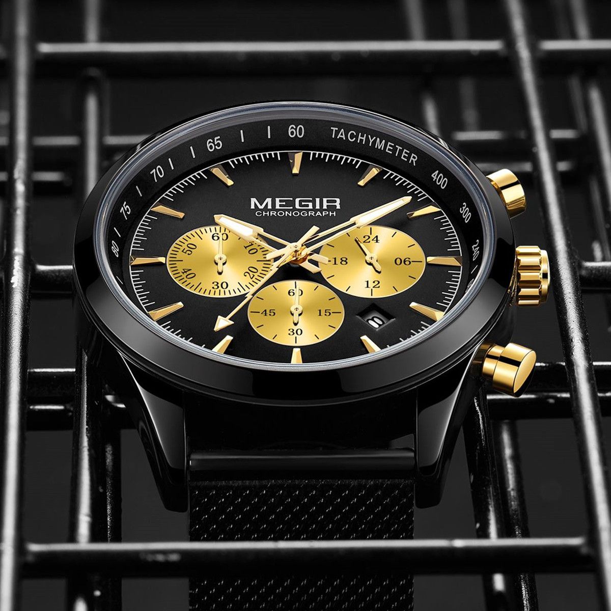 MEGIR 2153 men's chronograph watch, black case with black dial, gold sub-dials and black mesh bracelet, angled view