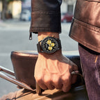MEGIR 2153 men's chronograph watch on the wrist, black case with black dial, gold sub-dials and black mesh bracelet