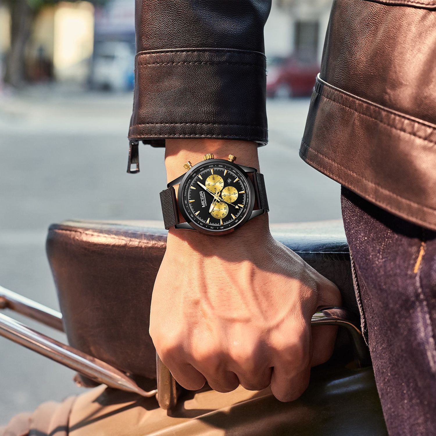 MEGIR 2153 men's chronograph watch on the wrist, black case with black dial, gold sub-dials and black mesh bracelet