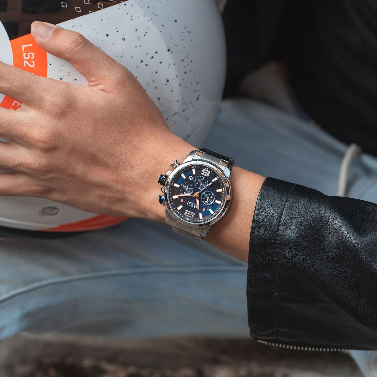 MEGIR 2156 men's chronograph watch on the wrist, silver case with blue dial and stainless steel bracelet, close-up