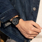 MEGIR 2157 men's chronograph watch on the wrist, black case with black dial and black mesh bracelet