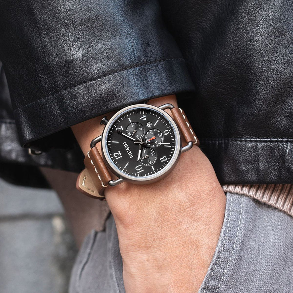 MEGIR 2158 men's chronograph watch on the wrist, black case with black dial and brown leather strap