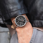 MEGIR 2158 men's chronograph watch on the wrist, black case with black dial and brown leather strap