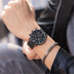 MEGIR 2158 men's chronograph watch on the wrist, black case with black dial and black mesh bracelet