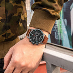 MEGIR 2159 men's chronograph watch on the wrist, black case with black dial and brown leather strap