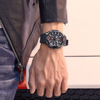 MEGIR 2161 men's chronograph watch on the wrist, black case with red-accent dial and black silicone strap